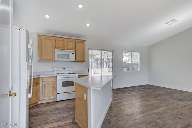 kitchen with white appliances, dark hardwood / wood-style floors, and a kitchen island