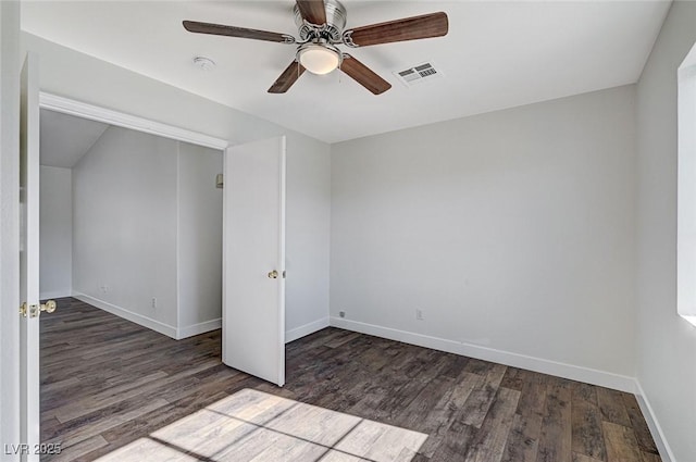 unfurnished bedroom with ceiling fan and dark hardwood / wood-style flooring