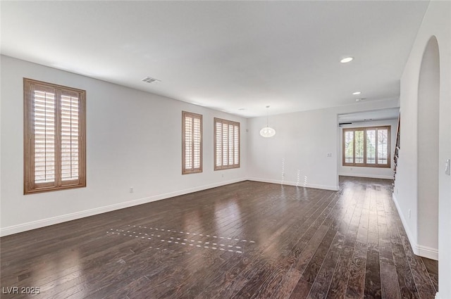 unfurnished room featuring dark wood-type flooring