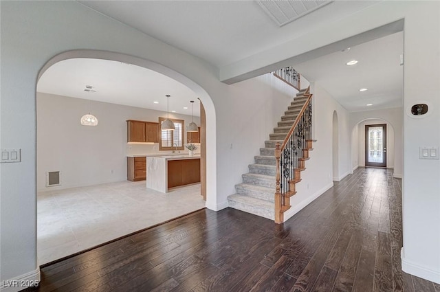 foyer entrance with wood-type flooring