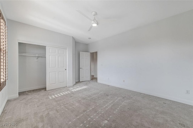 unfurnished bedroom with carpet floors, a closet, ceiling fan, and baseboards