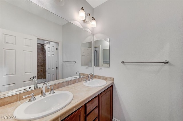 bathroom featuring vanity and a tub