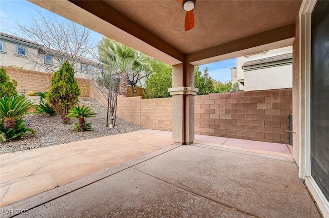 view of patio / terrace with a ceiling fan and a fenced backyard