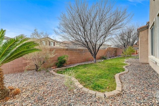 view of yard featuring a fenced backyard