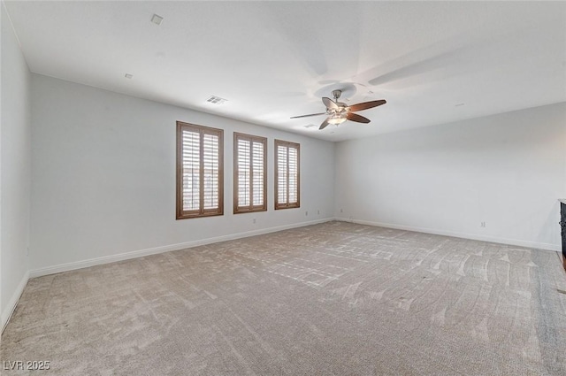 carpeted empty room with ceiling fan