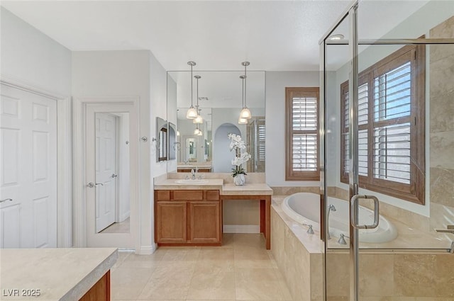 bathroom featuring independent shower and bath, vanity, and tile patterned flooring