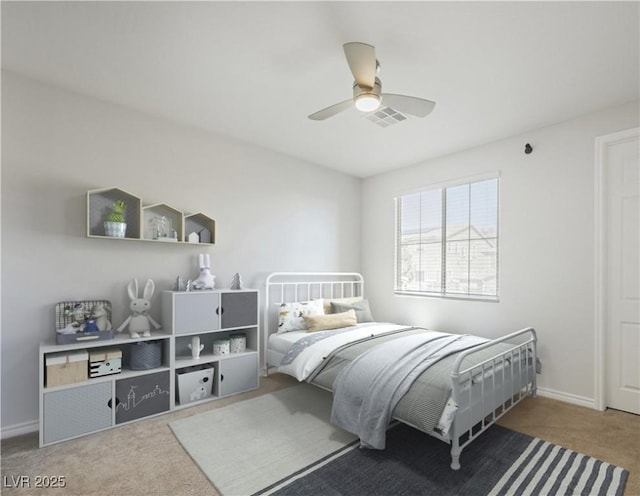 carpeted bedroom featuring a ceiling fan and baseboards