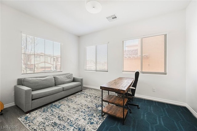 office featuring dark wood-style floors, baseboards, and visible vents