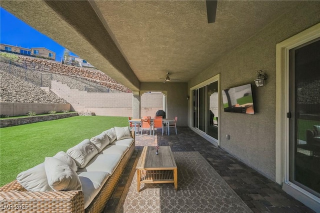 view of patio / terrace with a fenced backyard, an outdoor living space, and outdoor dining space