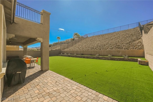 view of yard with outdoor dining area, a patio area, and a fenced backyard