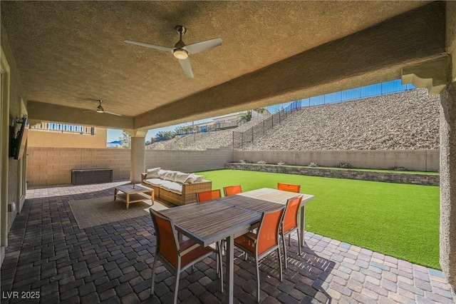 view of patio / terrace featuring a ceiling fan, outdoor dining space, outdoor lounge area, and a fenced backyard