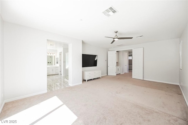 interior space with carpet flooring, visible vents, and baseboards