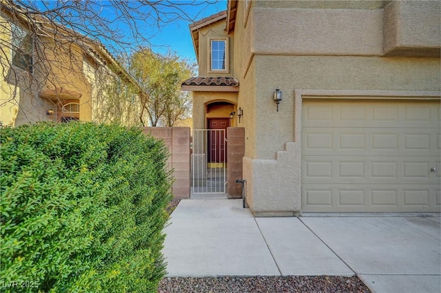 view of exterior entry with a garage