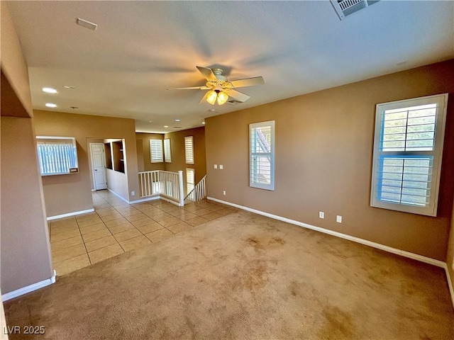 carpeted empty room with ceiling fan