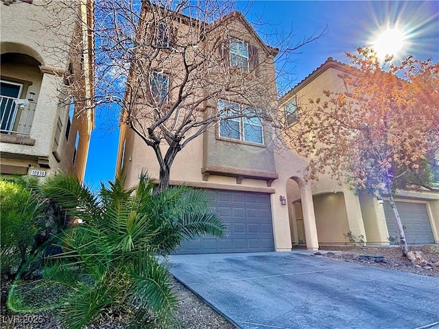 townhome / multi-family property featuring a garage