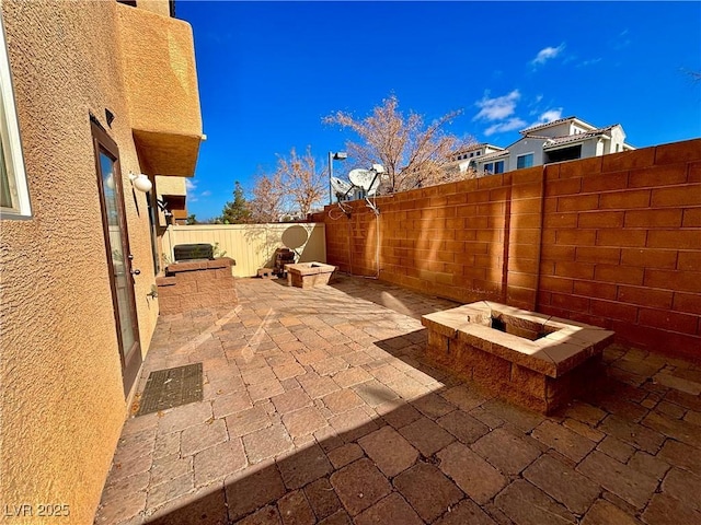 view of patio / terrace with a fire pit