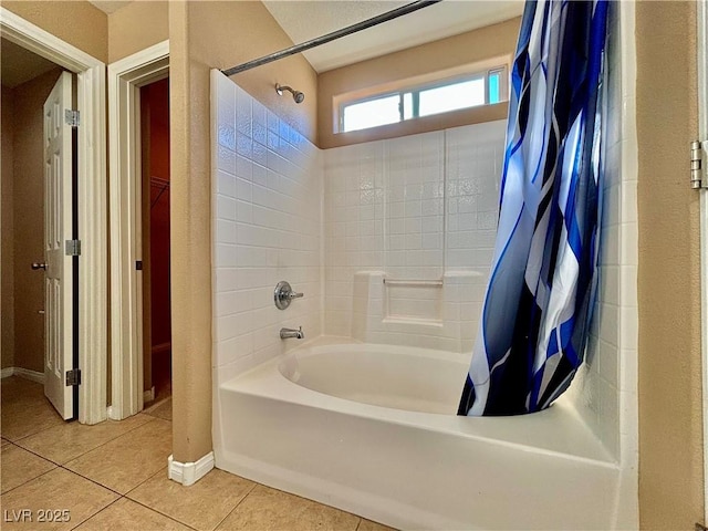 bathroom with shower / tub combo and tile patterned floors