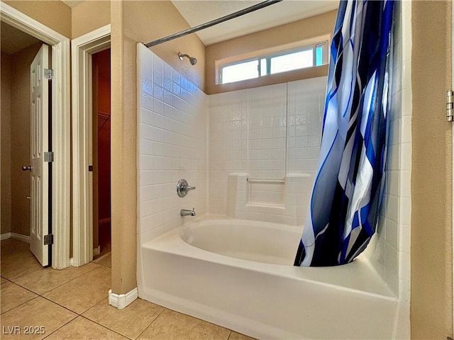 bathroom with tile patterned flooring and shower / bath combo