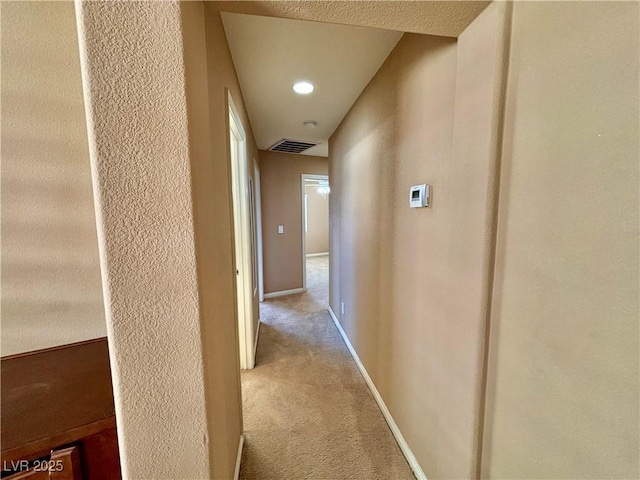 hallway with carpet flooring