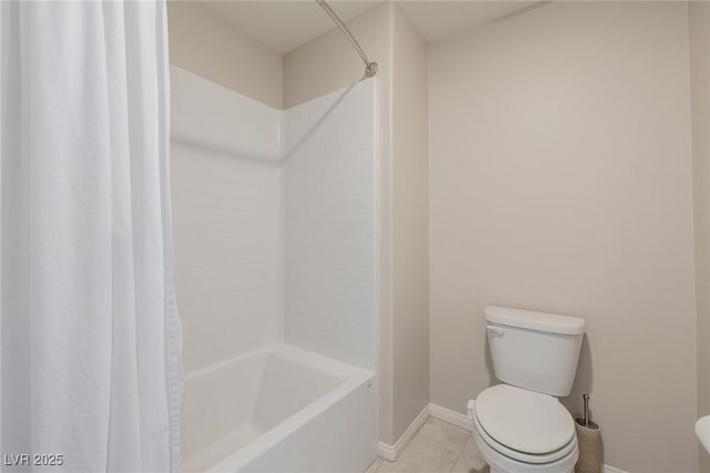 bathroom with tile patterned flooring, toilet, and shower / bath combo with shower curtain