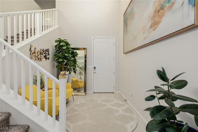 view of carpeted foyer entrance