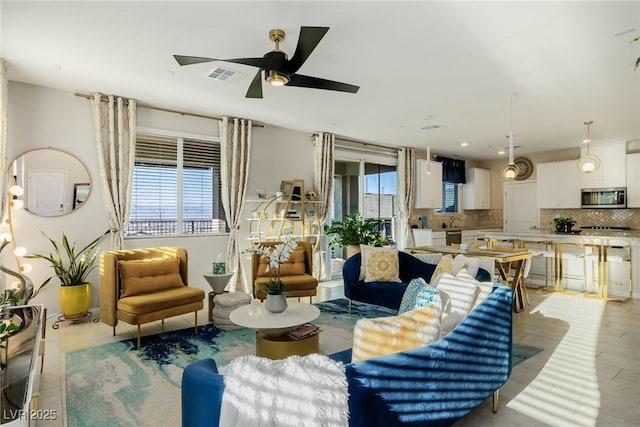 living room featuring ceiling fan