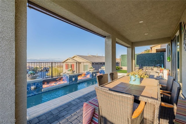 view of patio / terrace featuring a fenced in pool