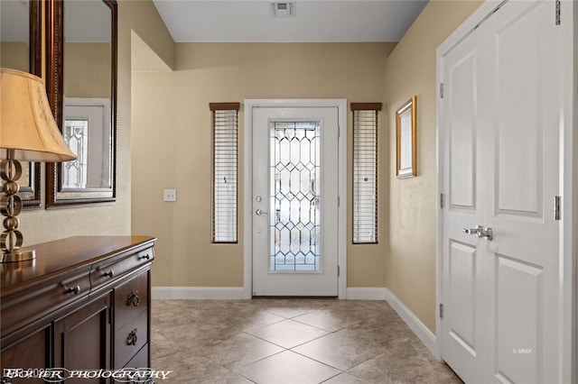 tiled entryway featuring plenty of natural light