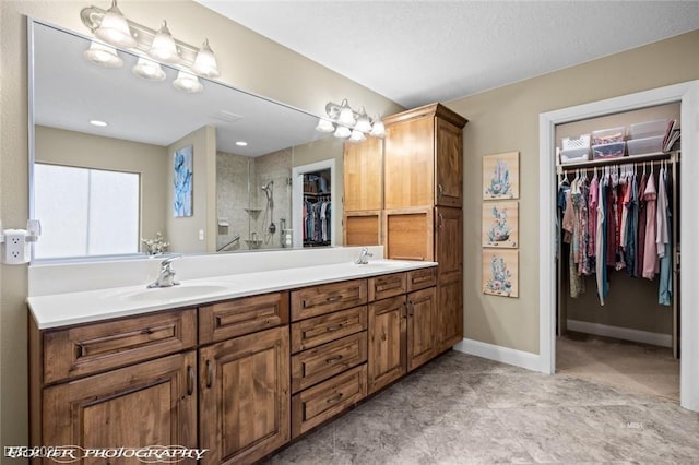 bathroom featuring vanity and a shower