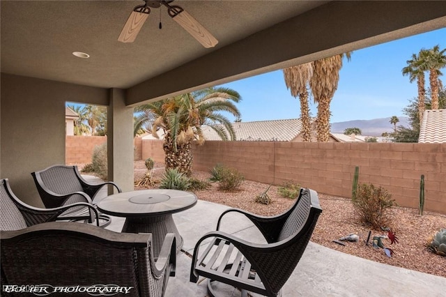 view of patio / terrace featuring ceiling fan