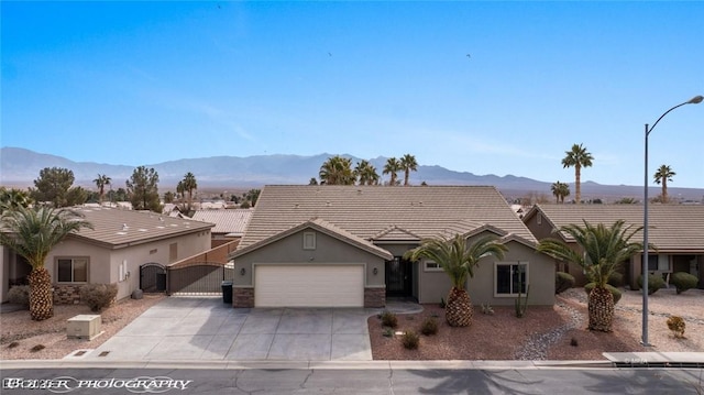 ranch-style house featuring a mountain view and a garage