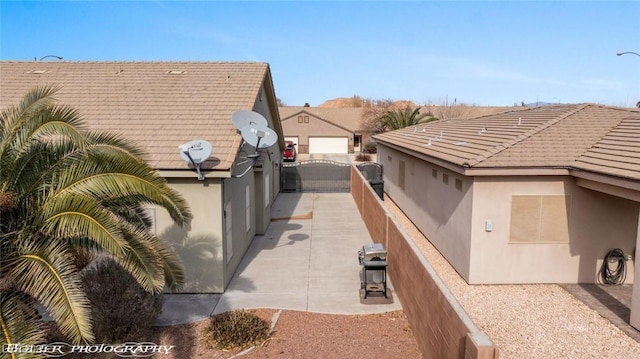 view of side of home featuring a patio area