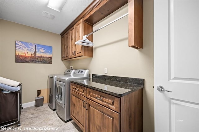 laundry area featuring cabinets and independent washer and dryer