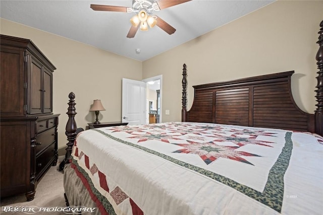 bedroom featuring light colored carpet and ceiling fan