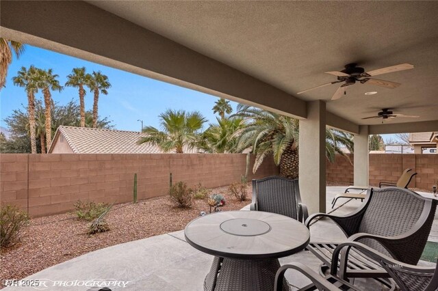 view of patio featuring ceiling fan