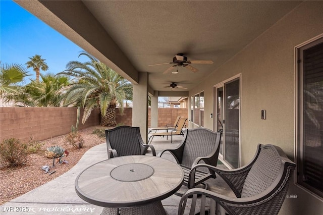 view of patio featuring ceiling fan