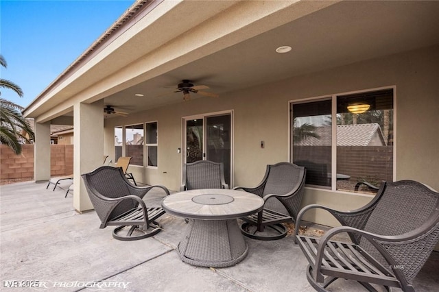 view of patio featuring ceiling fan