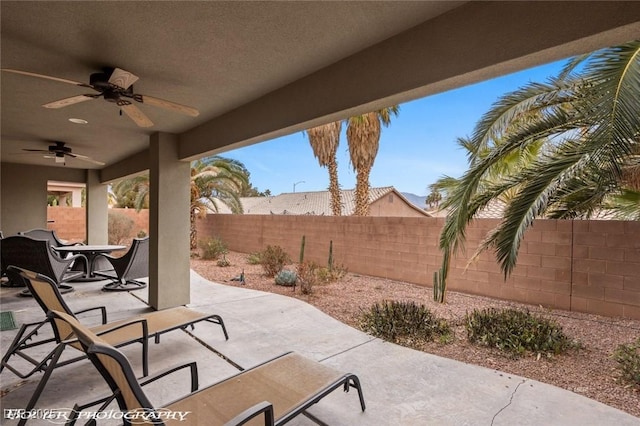 view of patio featuring ceiling fan