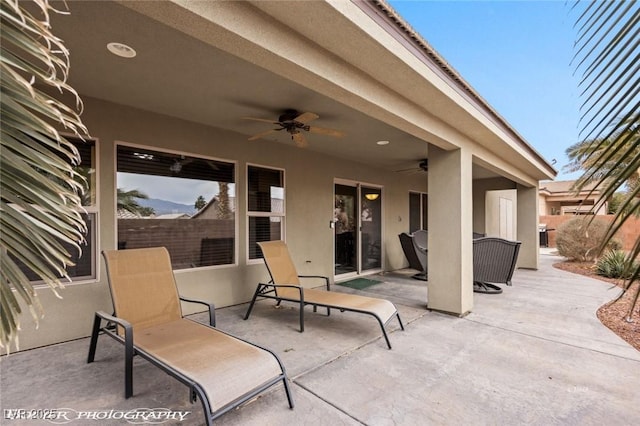 view of patio featuring ceiling fan