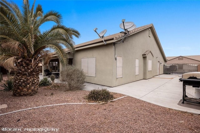 back of property with a patio area