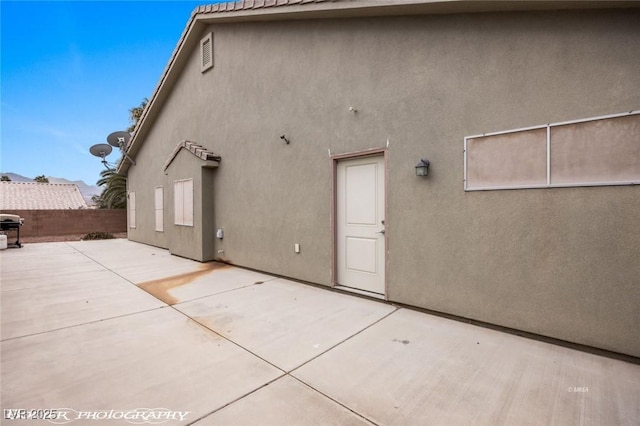 back of house featuring a patio area