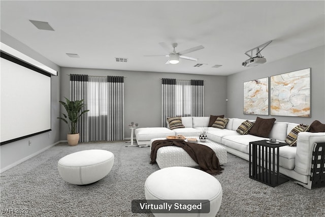 carpeted cinema with baseboards, visible vents, and a wealth of natural light