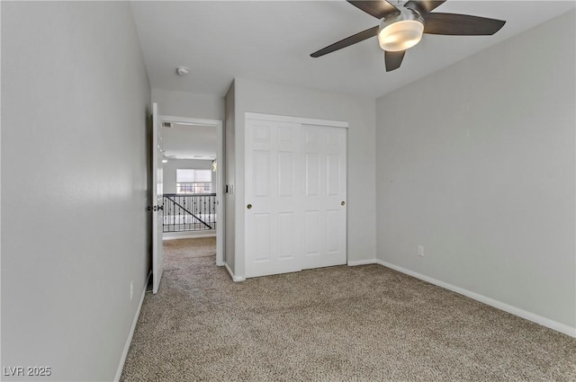 unfurnished bedroom with baseboards and carpet flooring