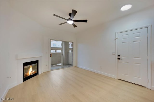 unfurnished living room with light hardwood / wood-style floors and ceiling fan