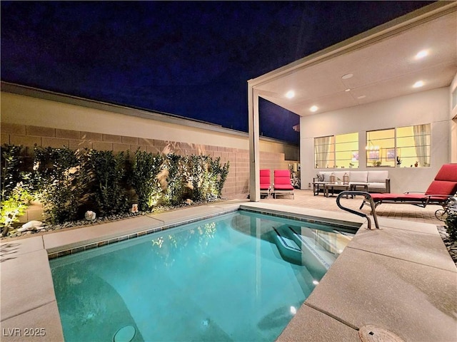 view of swimming pool featuring an outdoor living space and a patio area