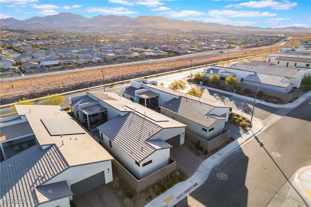 birds eye view of property featuring a mountain view