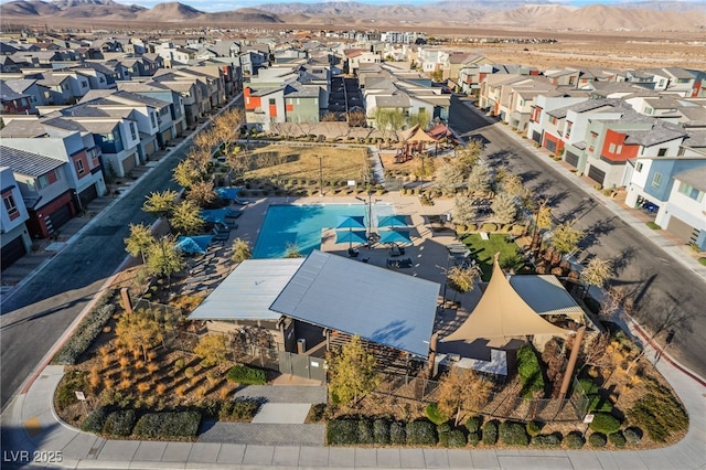 birds eye view of property featuring a mountain view