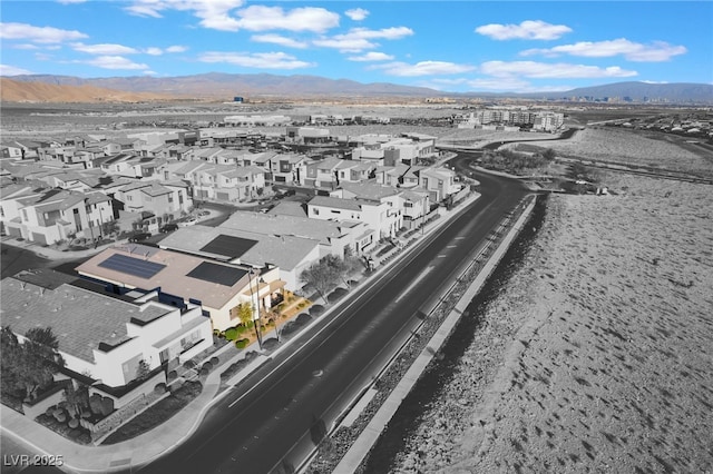 birds eye view of property featuring a mountain view