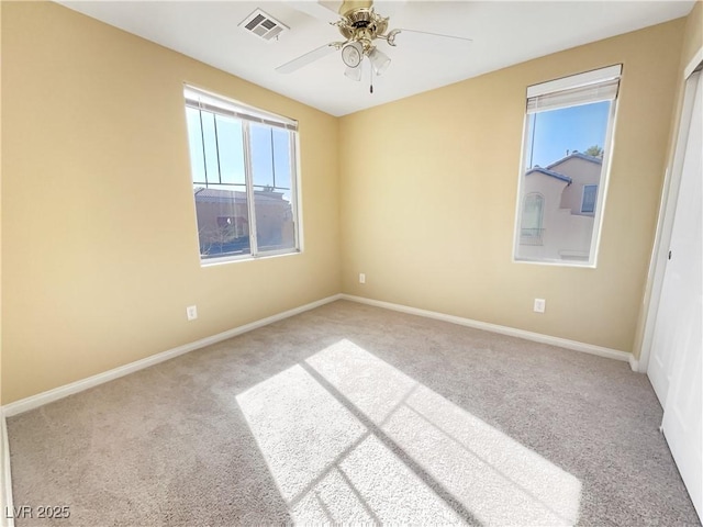 carpeted empty room with ceiling fan