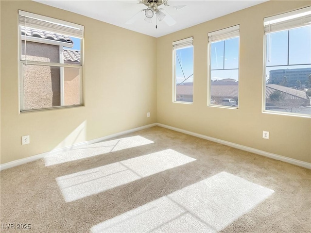 unfurnished room with carpet flooring and ceiling fan